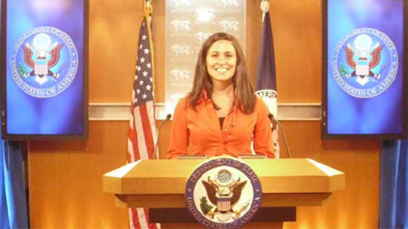 Julia Barham standing at the podium during a press briefing at the State Department.