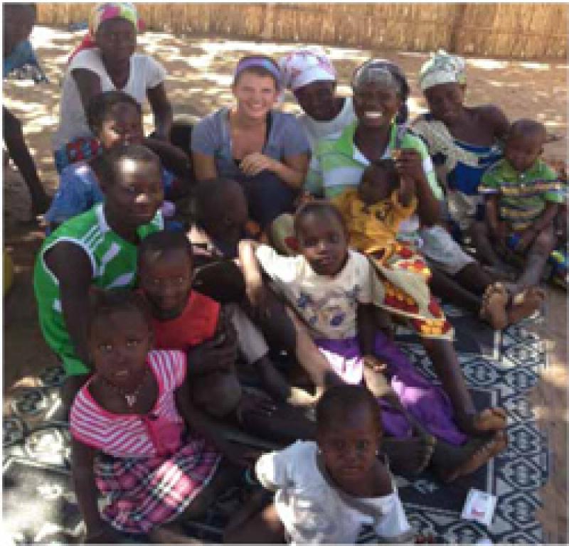 Leslie Minney with local children in Senegal.