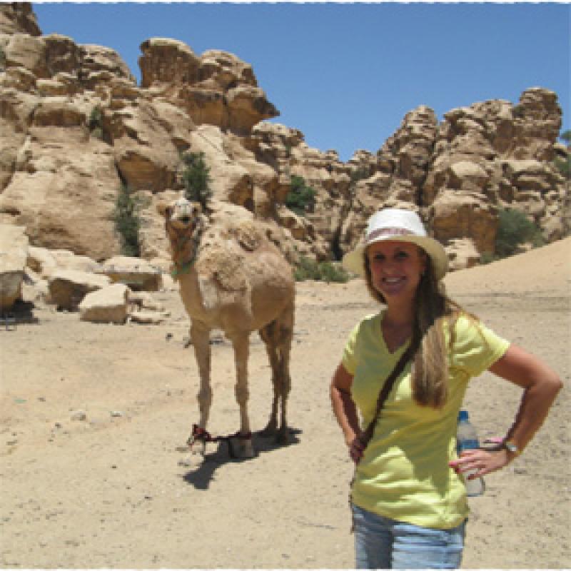 Stephanie with one of the camels of the Al‐Amareen tribe.