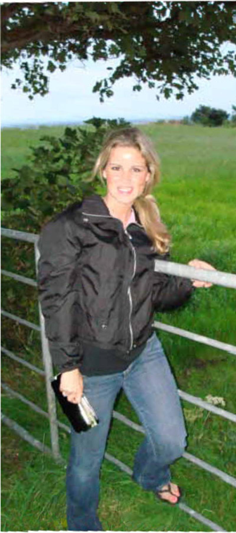 Alicia Anzivine next to a European field.