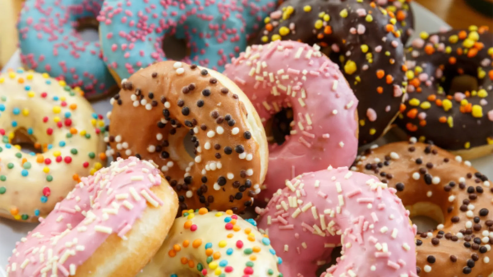A closeup of multiple colorful donuts