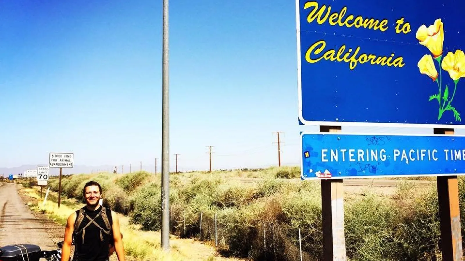 An image of Nick Orsini at the California border as part of his ride to benefit ALS.