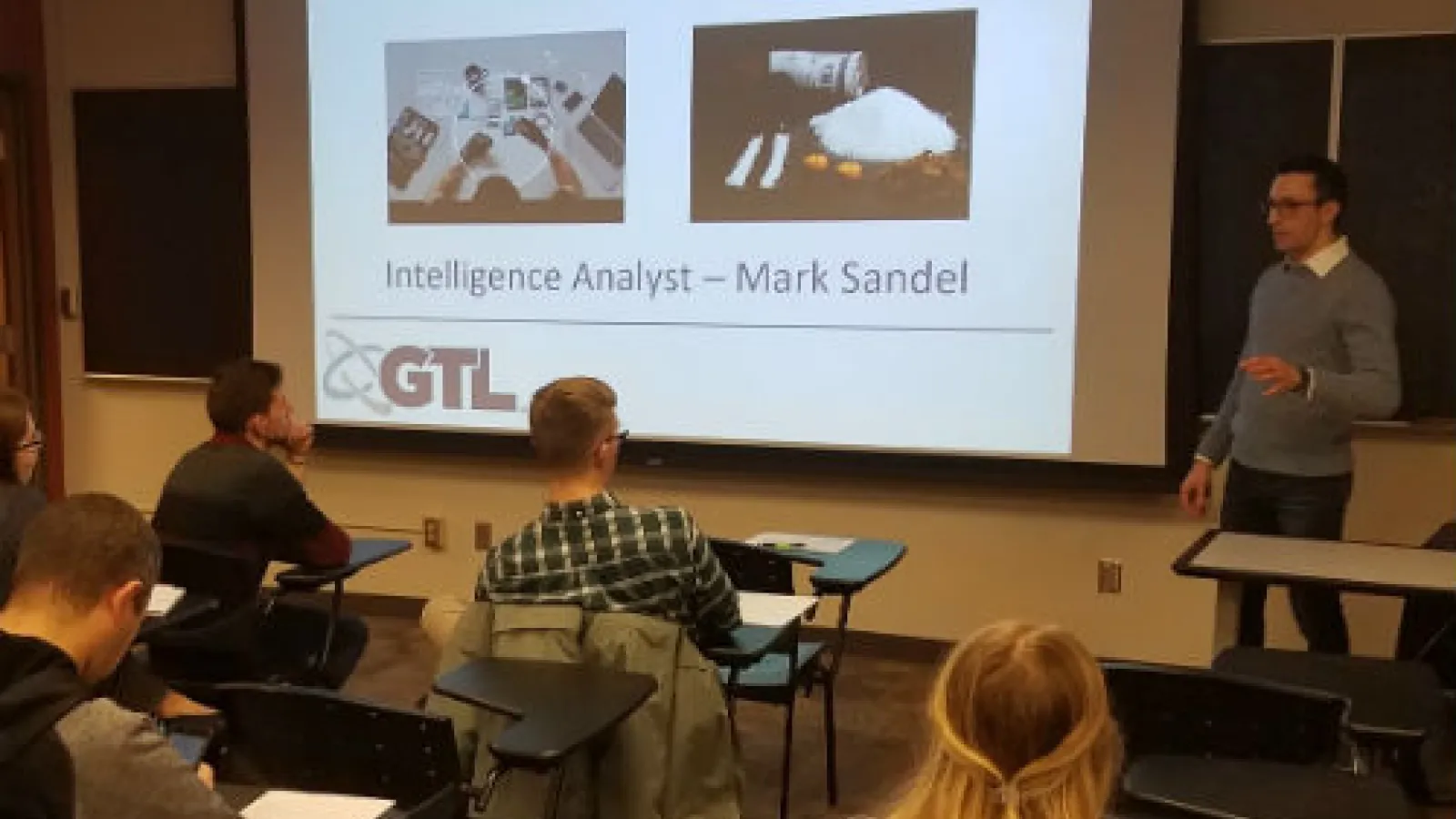 An image of Alum Mark Sandel delivering a presentation to the Security and Intelligence Club.