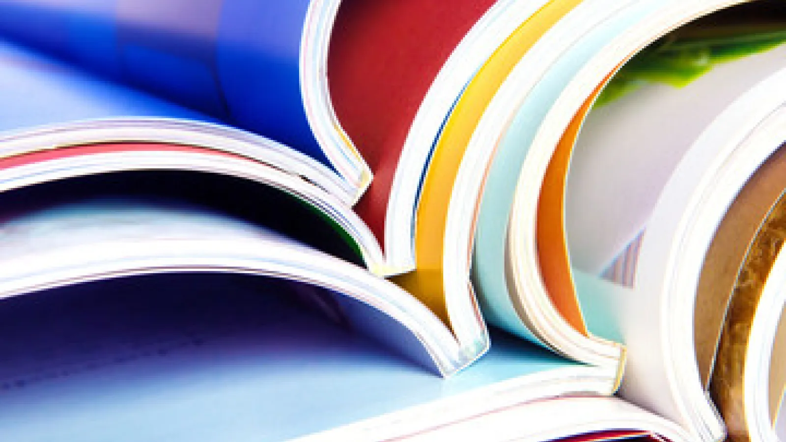 An image of multicolored catalogs