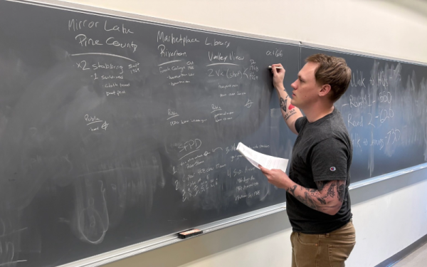 A student participating in the Intelligence in Action Midnight Stalker simulation