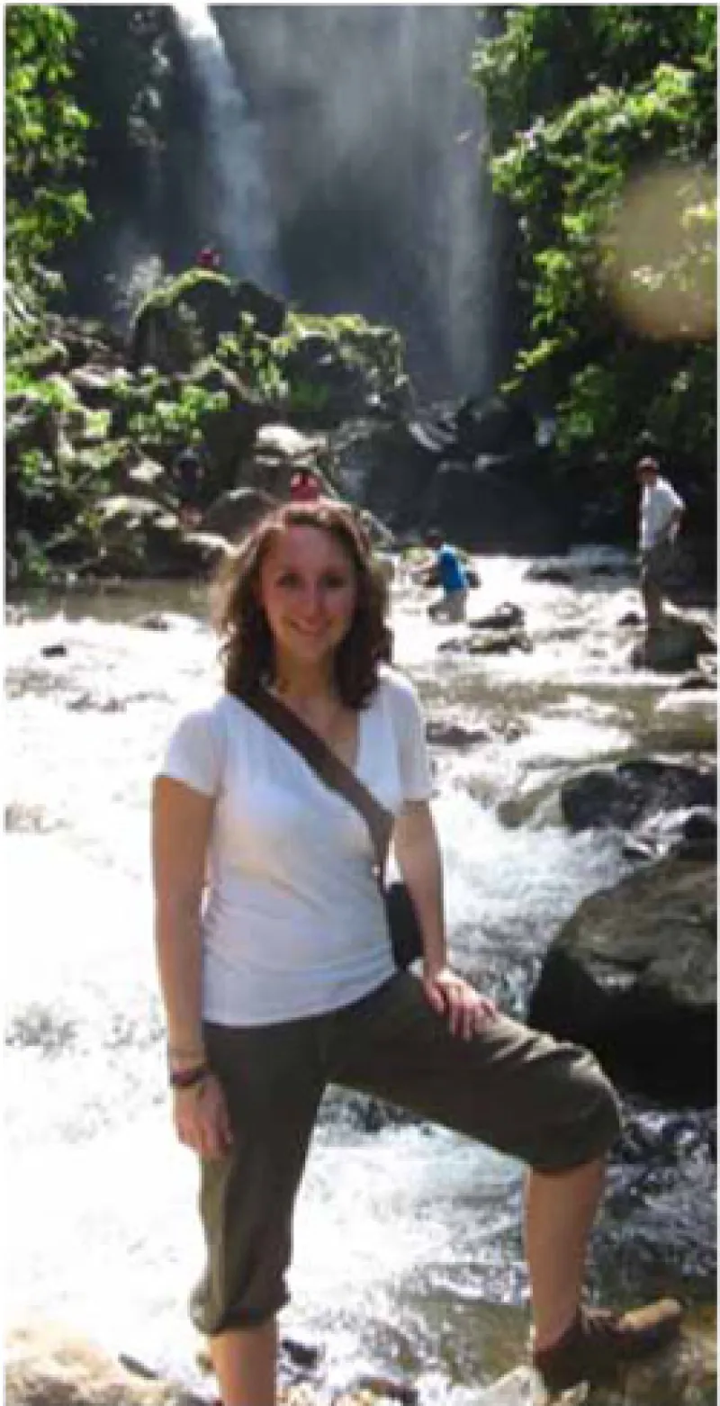 Katherine Voldrich stands in a river in Tanzania.
