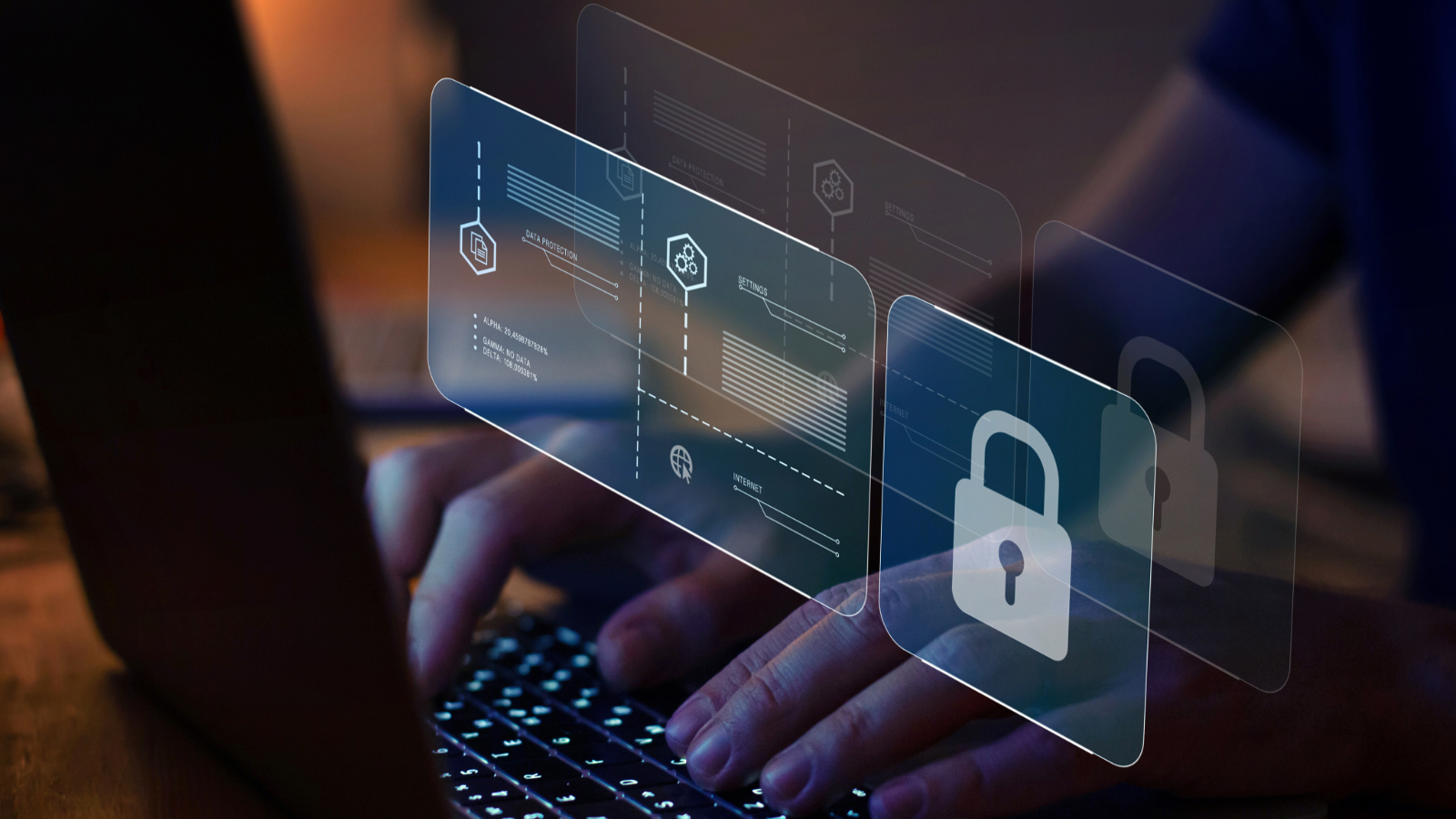 Hands typing on a laptop overlayed with a security graphic