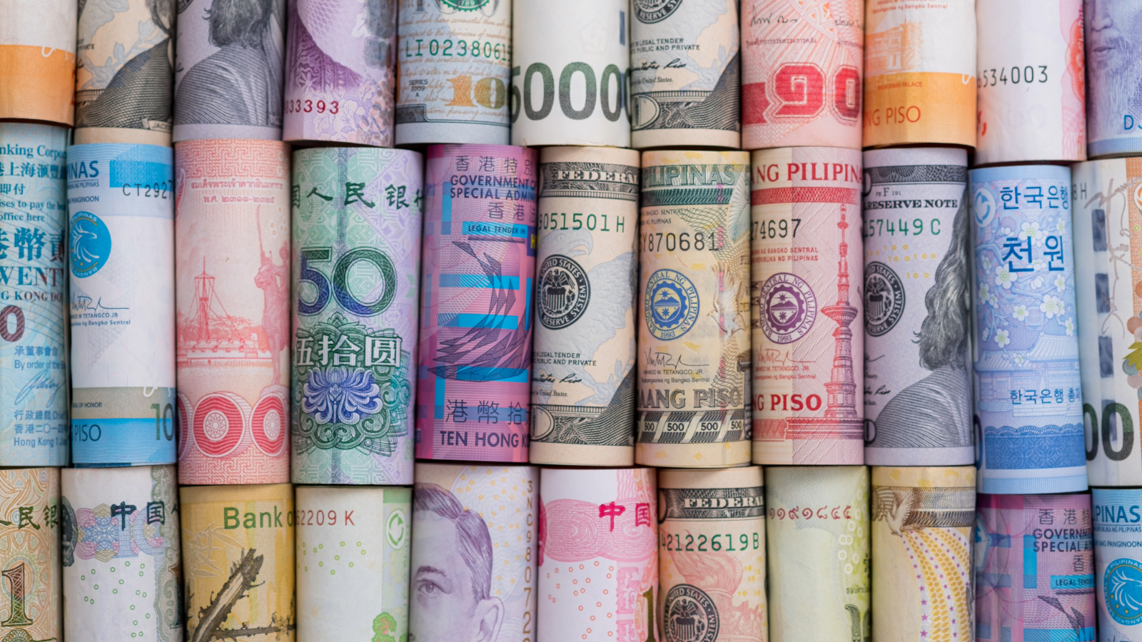 Colorful rolls of bills from around the world