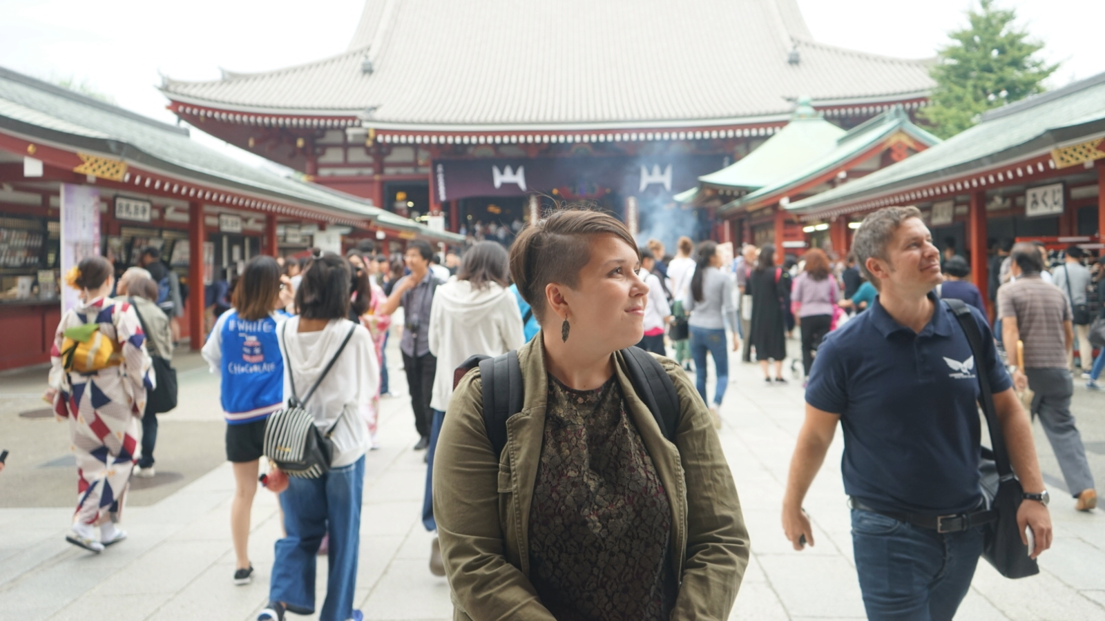 A study abroad student walking through a crowd in Asia