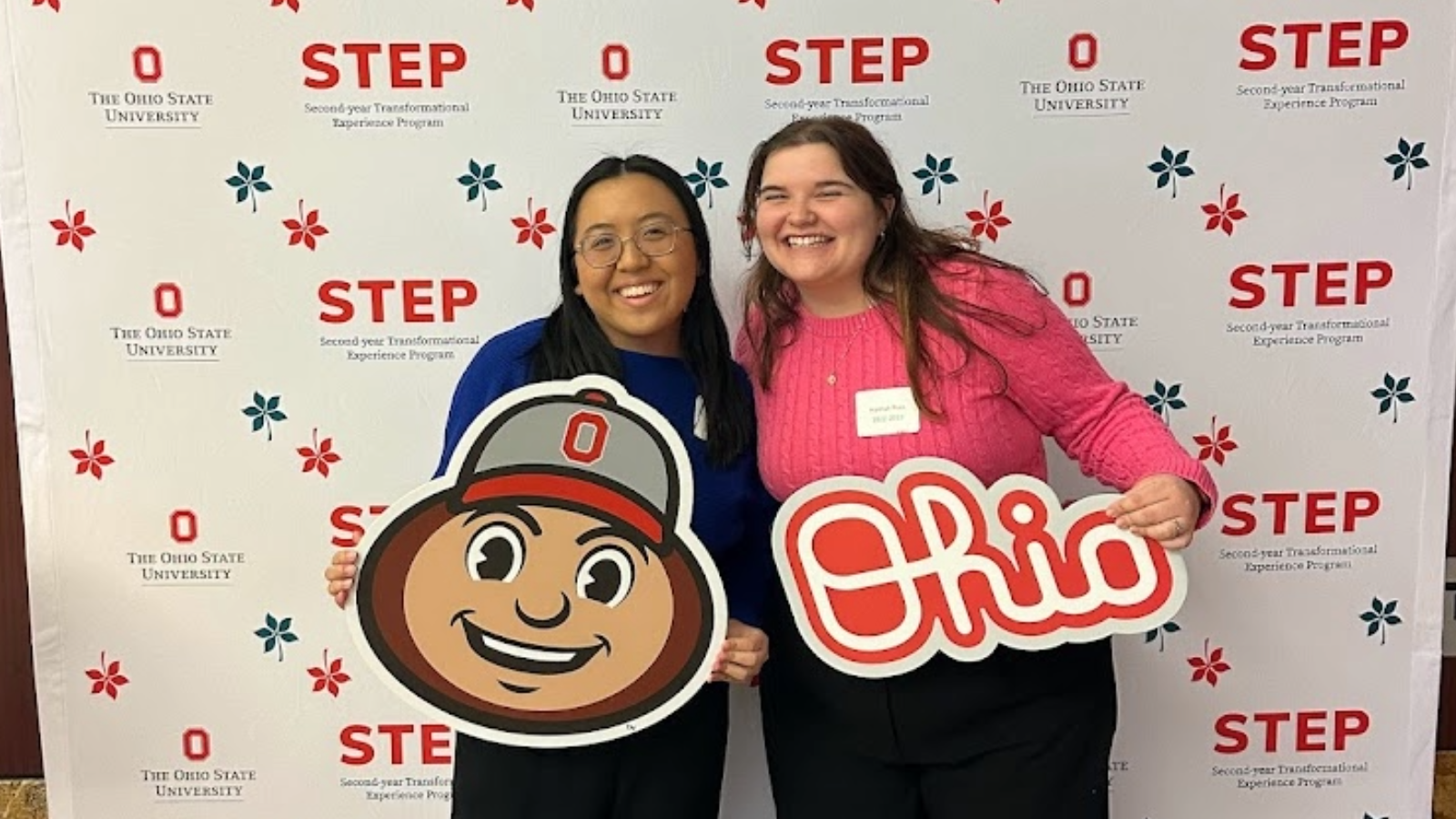 Two students posing in front of a backdrop for Ohio State's STEP program