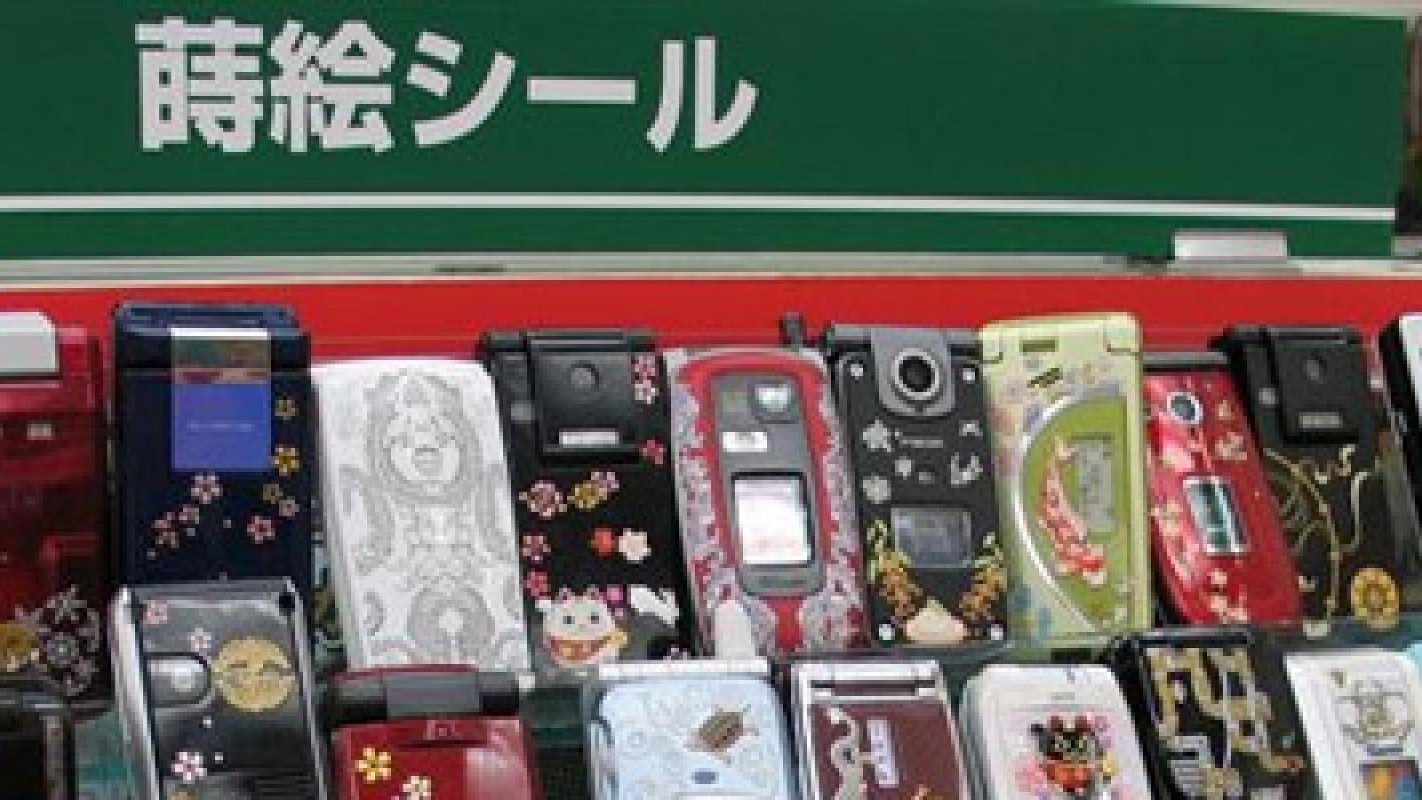 A variety of cell phones for sale at an electronics stall.