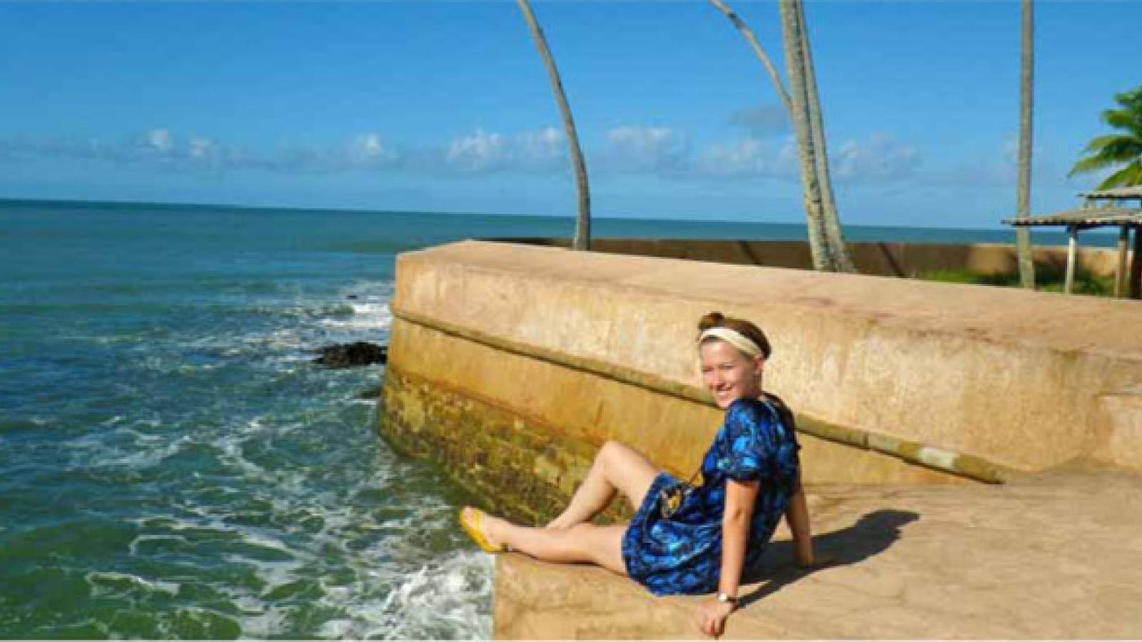 Shelby Stults next to the ocean in Brazil.