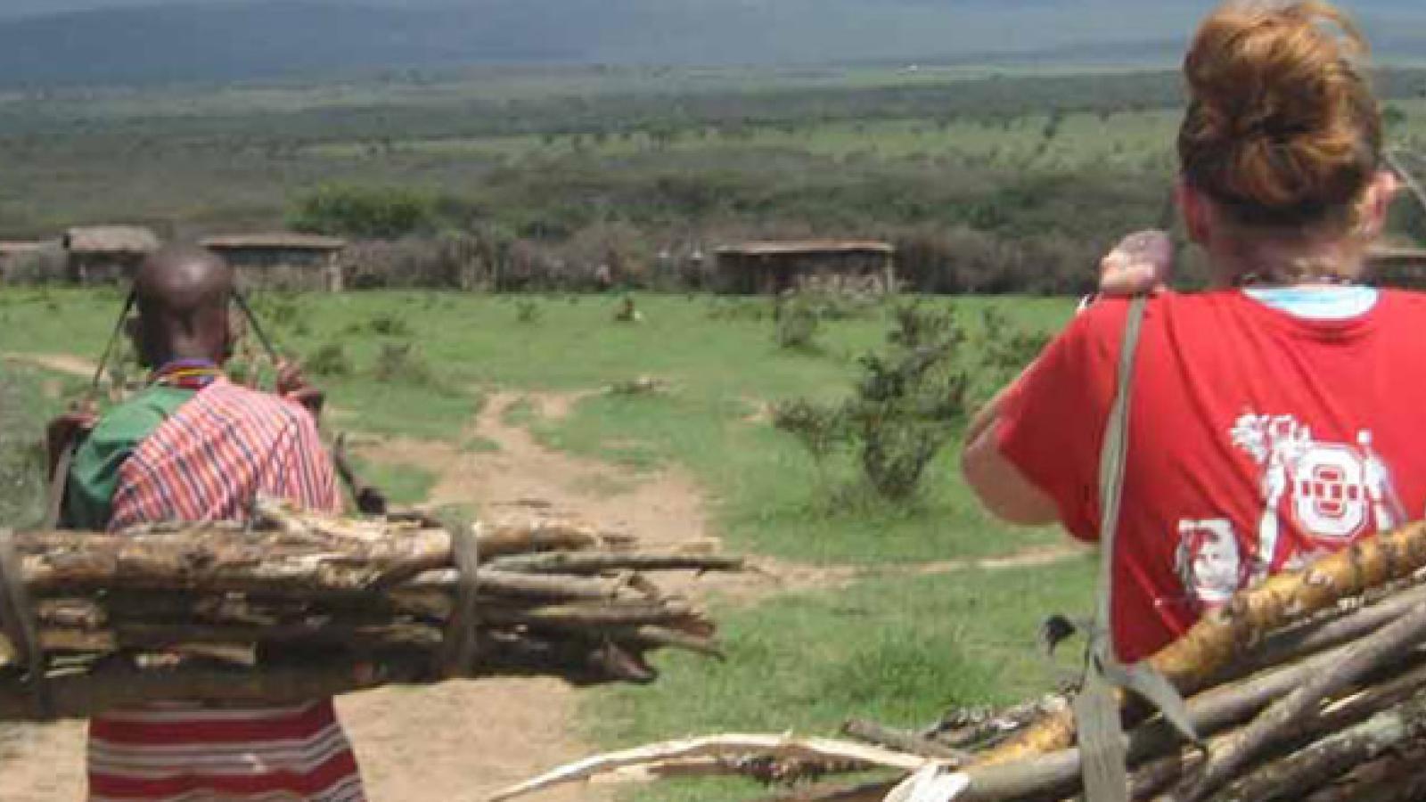 Kathryn gathering cooking fuel with her host Mom.