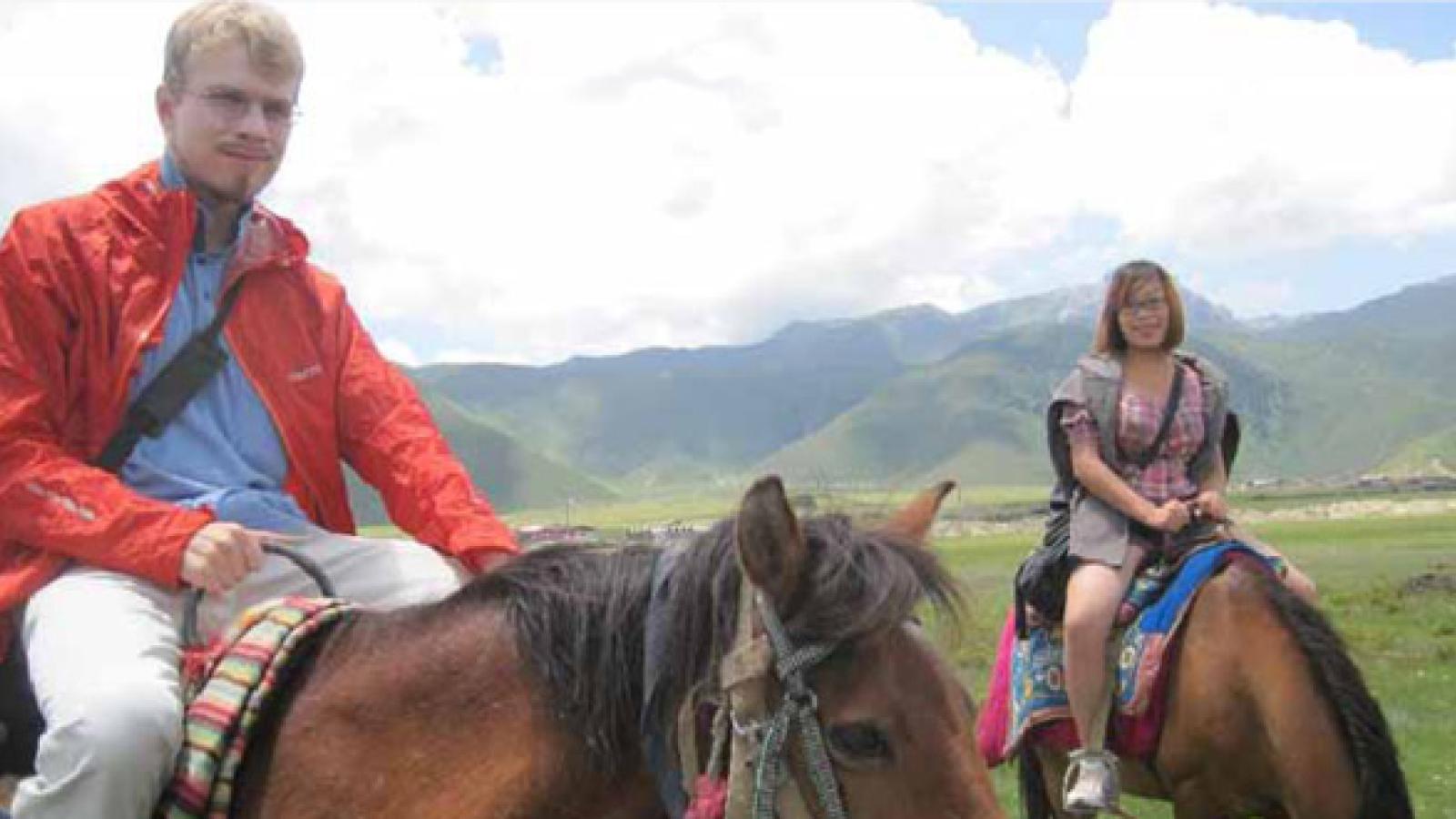 Alexander Long on a horse in China.