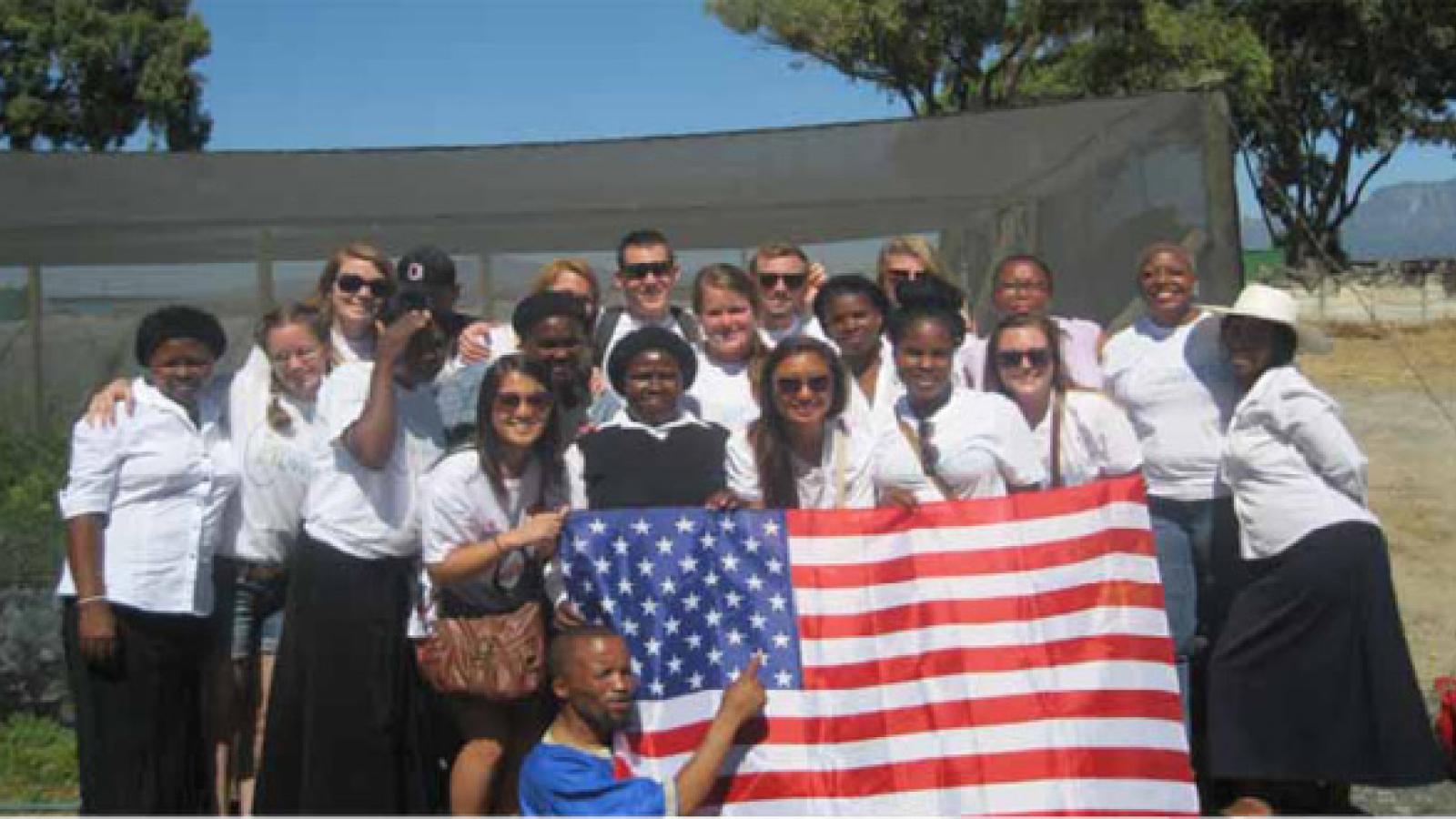 Local and foreign students pose for a group photo.