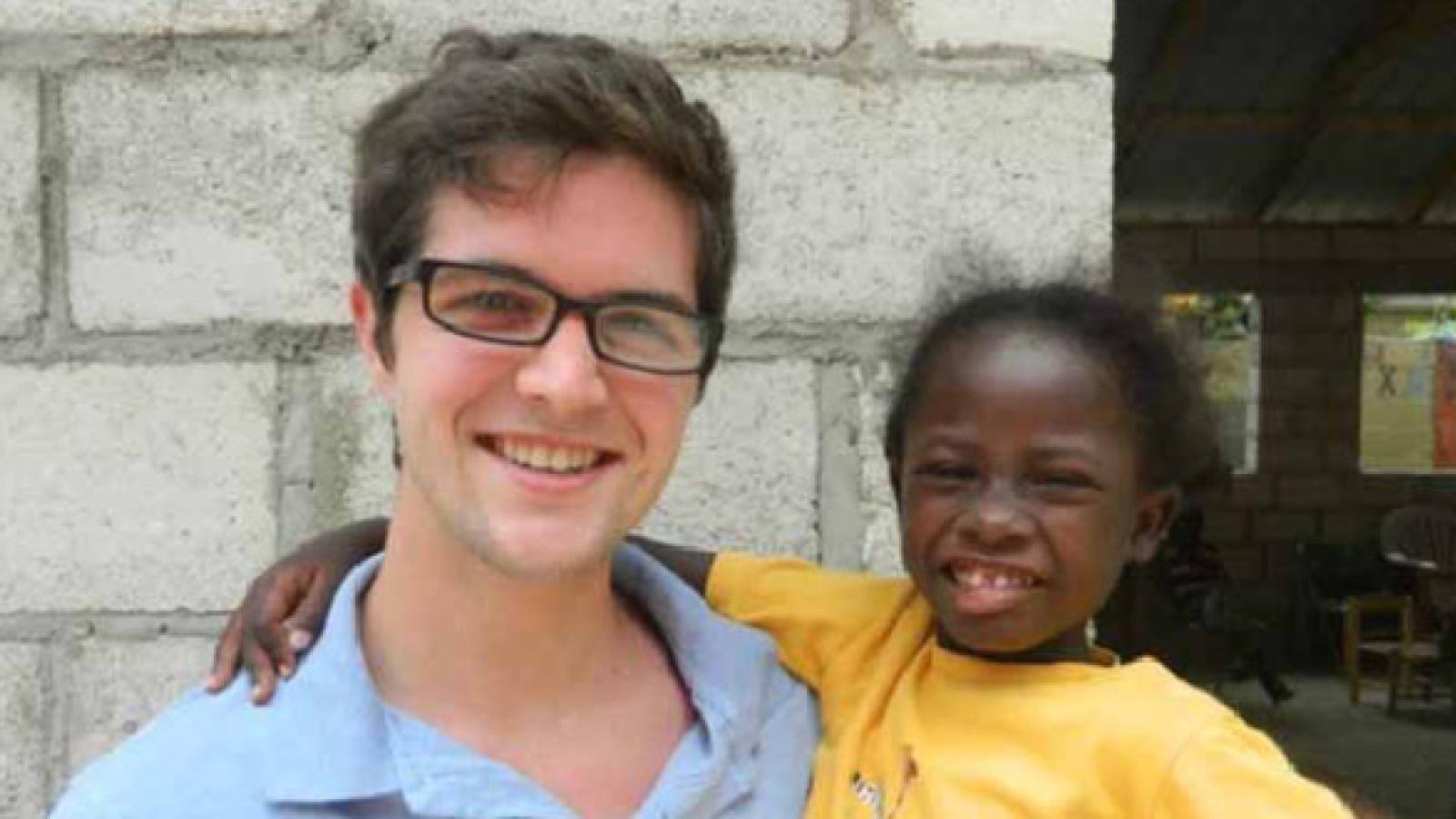 Jacob Bogart with a student from Haiti.
