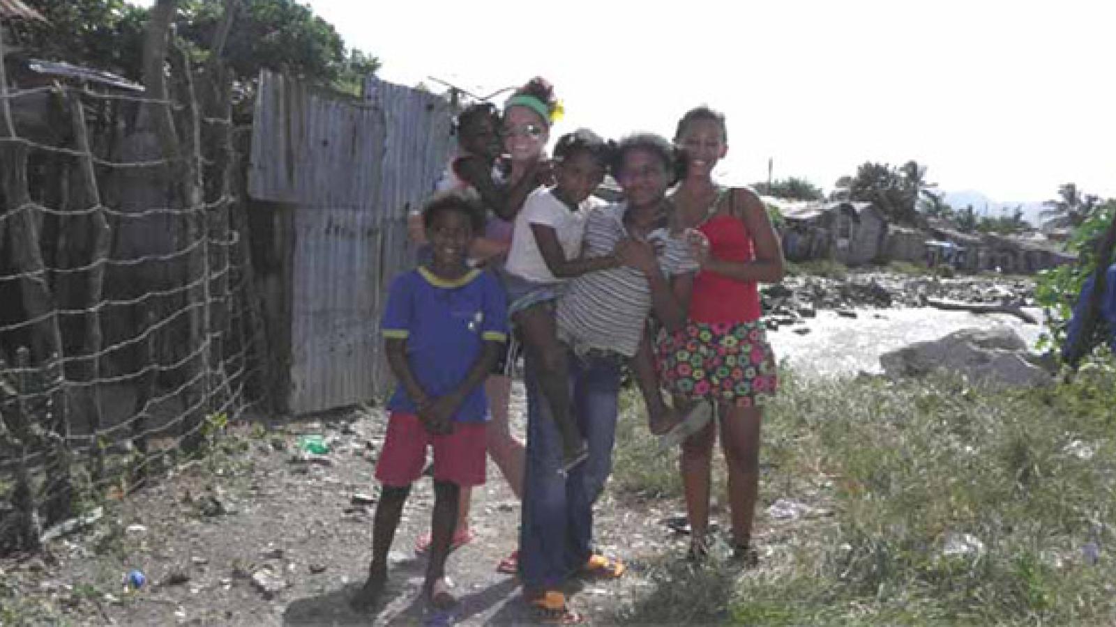 Kara Lapso (green headband) with children at the Dove Missions, Dominican Republic.